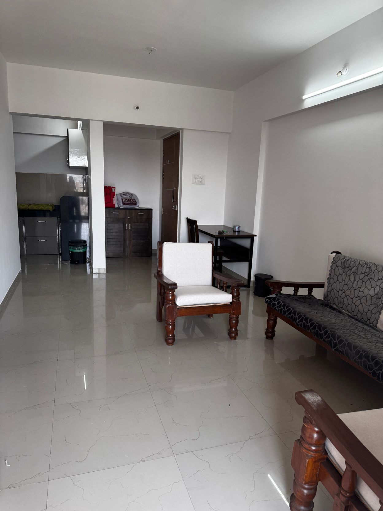 Spacious living room with sofa, TV unit & balcony access – Fully furnished comfort.